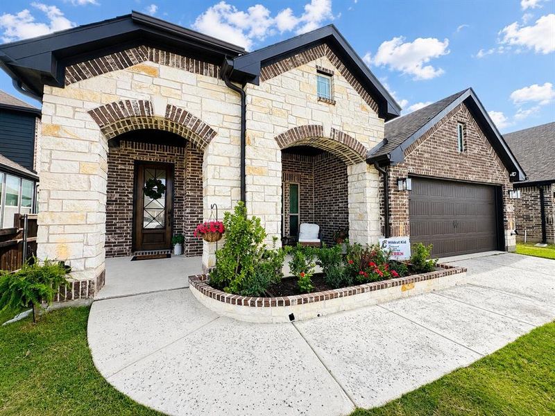 Front exterior of a new home in Silo Mills, Joshua, TX, highlighting curb appeal (Image 2).