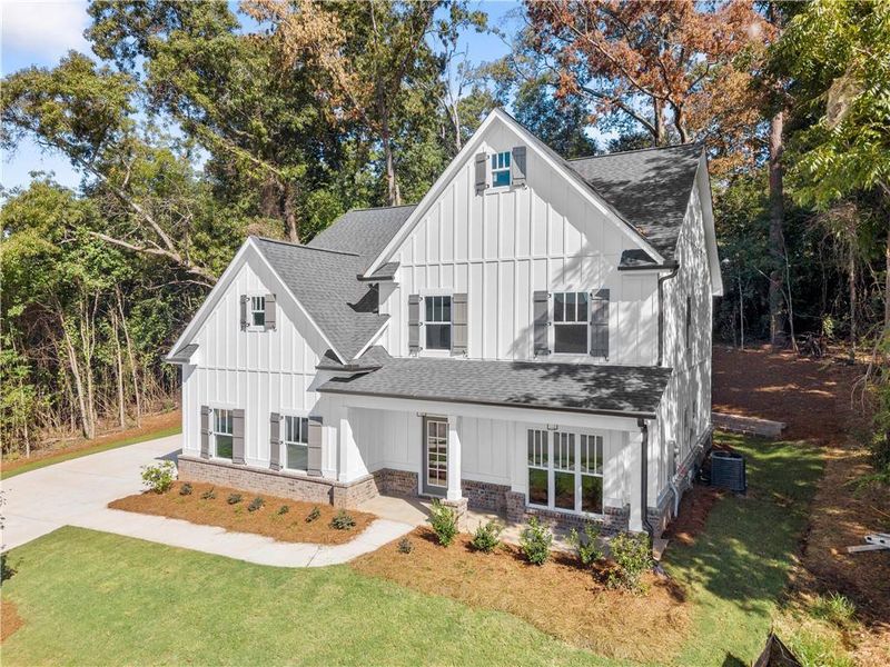 Front exterior of a new home in , Covington, GA, highlighting curb appeal (Image 19). Front exterior of a new home in , Covington, GA, highlighting curb appeal (Image 19).