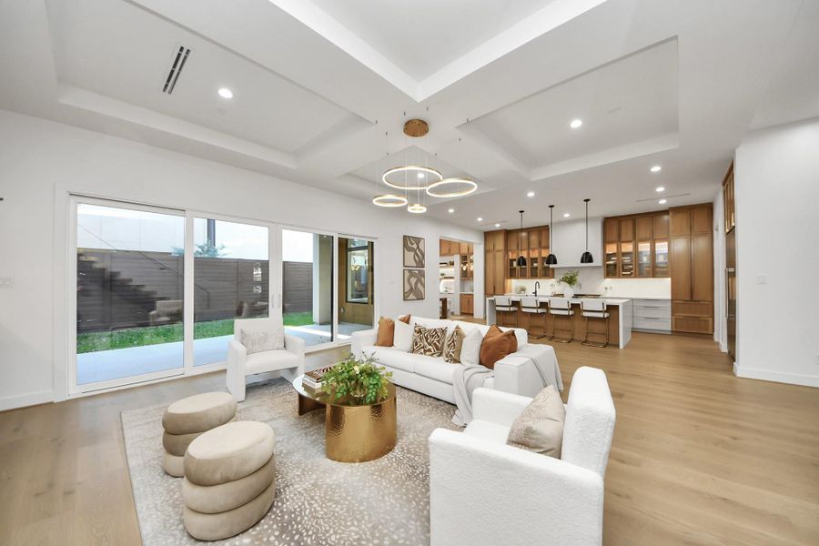Large sliding glass doors lead to a covered patio.