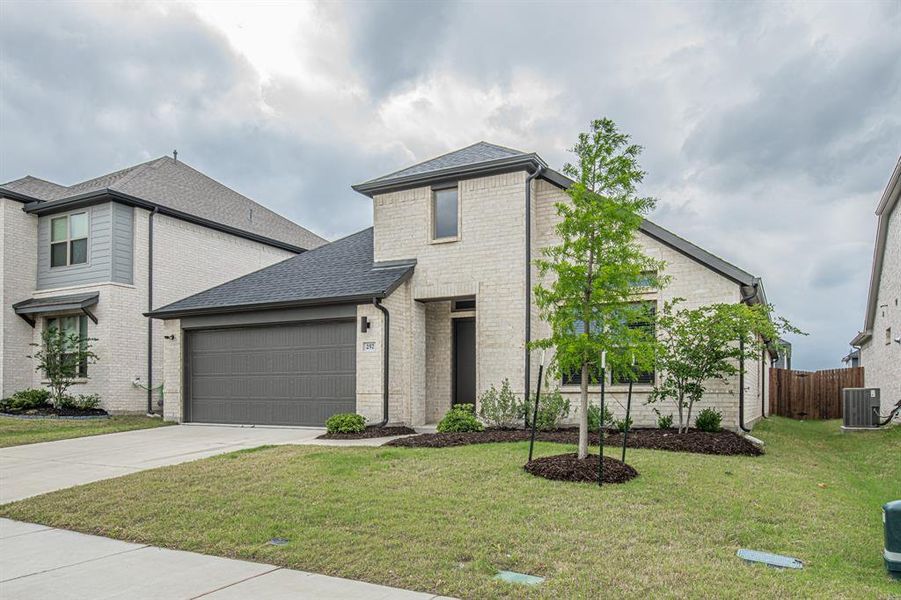 Front exterior of a new home in Elevon, Lavon, TX, highlighting curb appeal (Image 17).