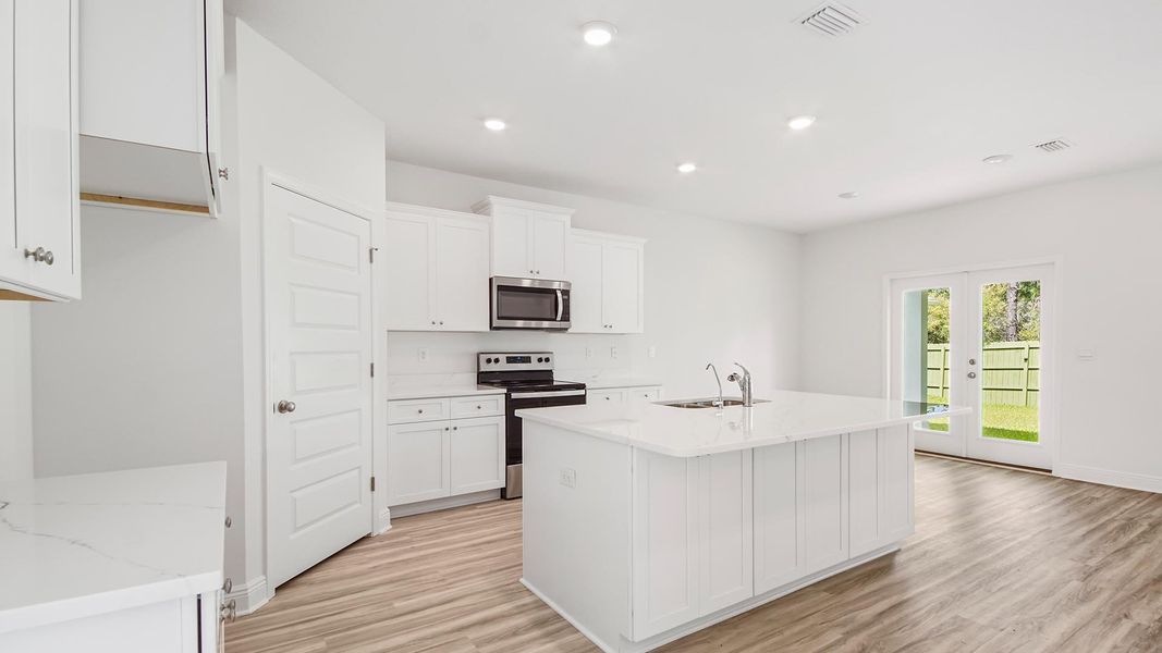 Furnished interior view inside a new home in Bayside at Ward Creek, Panama City Beach (Image 9).