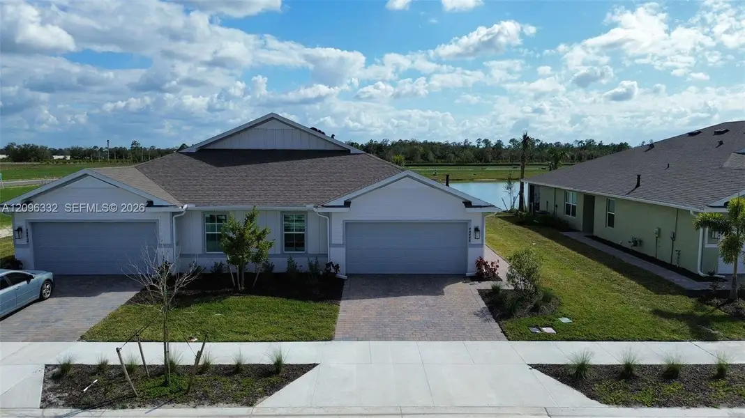 Front exterior of a new home in , Punta Gorda, FL, highlighting curb appeal (Image 1). Front exterior of a new home in , Punta Gorda, FL, highlighting curb appeal (Image 1).