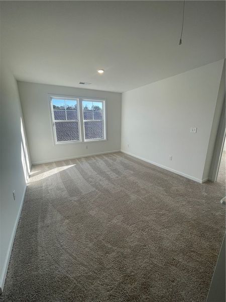Spacious, unfurnished interior of a new home in Springwood Grove, Central (Image 14).