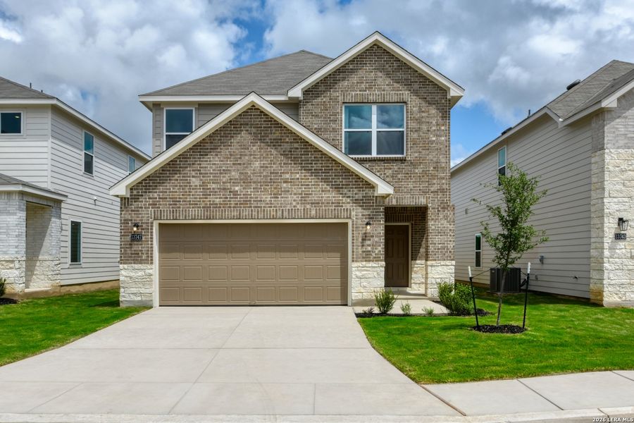 Front exterior of a new home in Hennersby Hollow, San Antonio, TX, highlighting curb appeal (Image 1). Front exterior of a new home in Hennersby Hollow, San Antonio, TX, highlighting curb appeal (Image 1).
