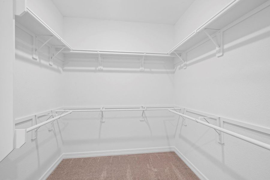 A view of your large primary walk-in Closet