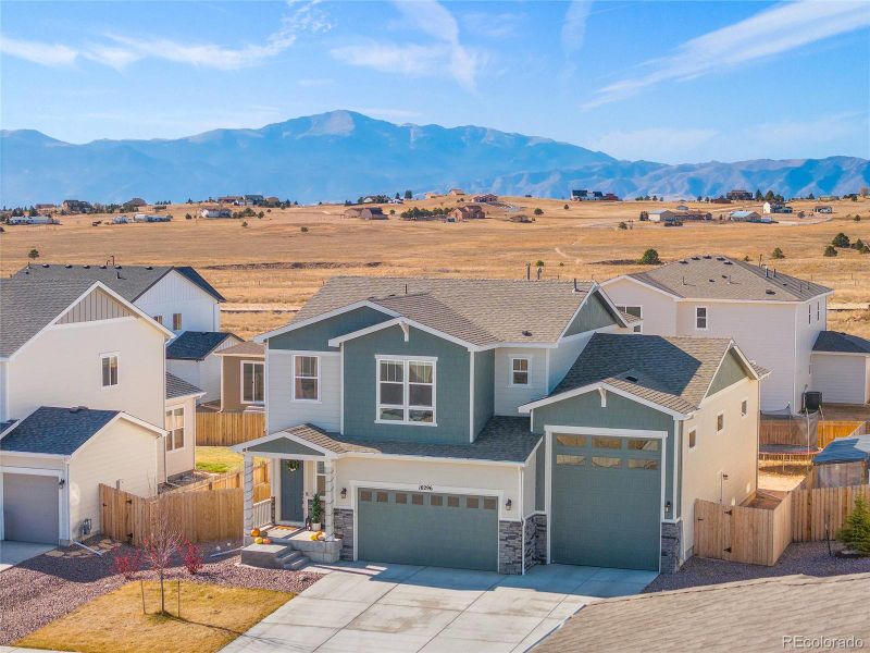 Front exterior of a new home in Paint Brush Hills, Peyton, CO, highlighting curb appeal (Image 26).