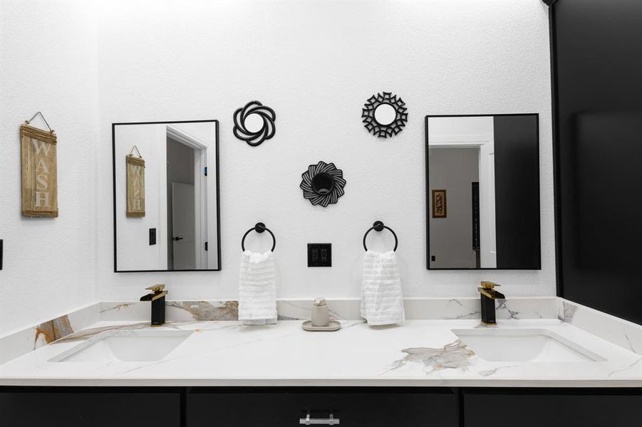 Full bath featuring double vanity