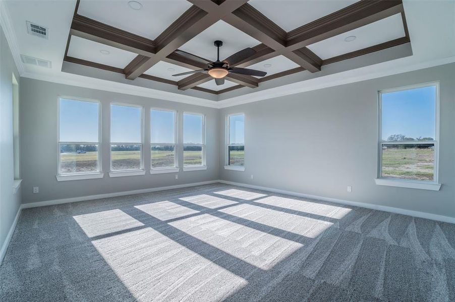 Carpeted spare room with crown molding, coffered ceiling, a ceiling fan, and beamed ceiling Carpeted spare room with crown molding, coffered ceiling, a ceiling fan, and beamed ceiling
