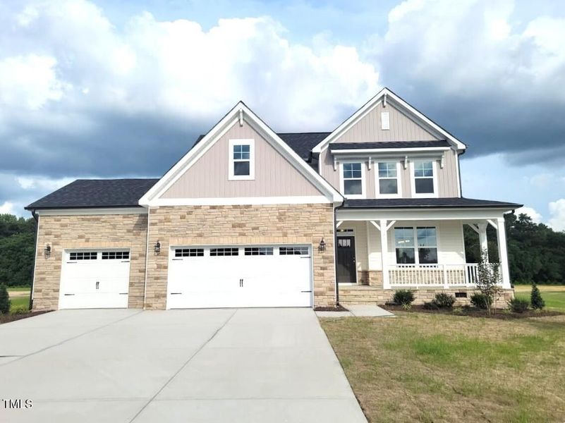 Front exterior of a new home in Tobacco Road, Angier, NC, highlighting curb appeal (Image 80). Front exterior of a new home in Tobacco Road, Angier, NC, highlighting curb appeal (Image 80).