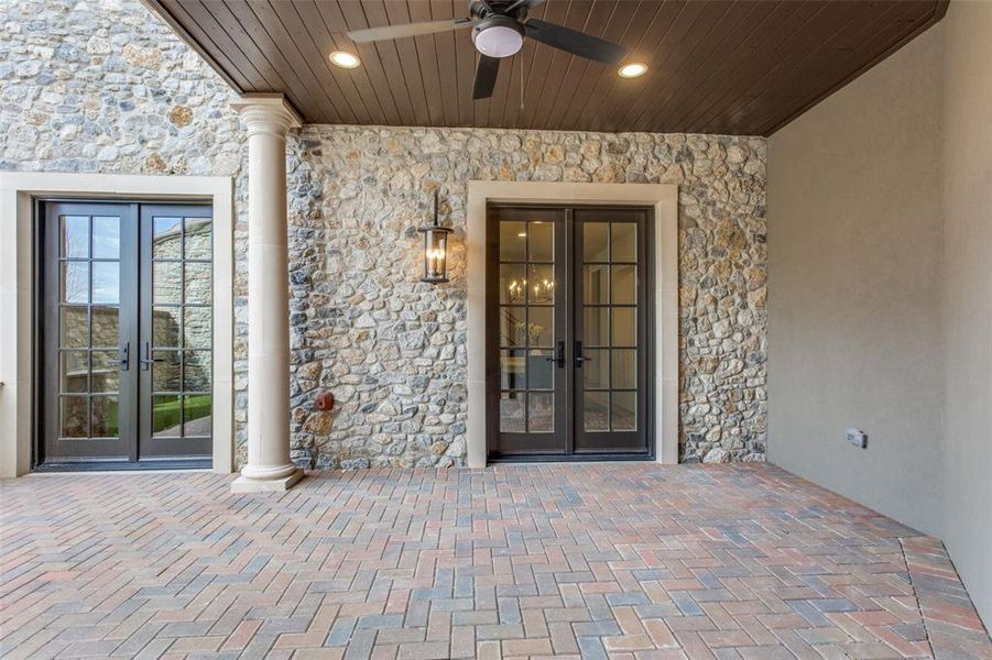 Entrance to property with french doors and ceiling fan