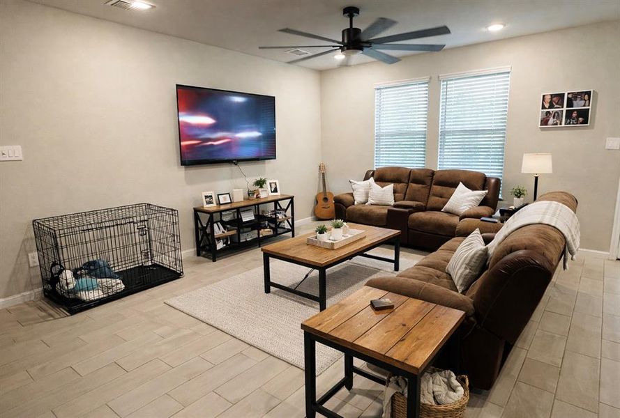 Living area with ceiling fan and recessed lighting