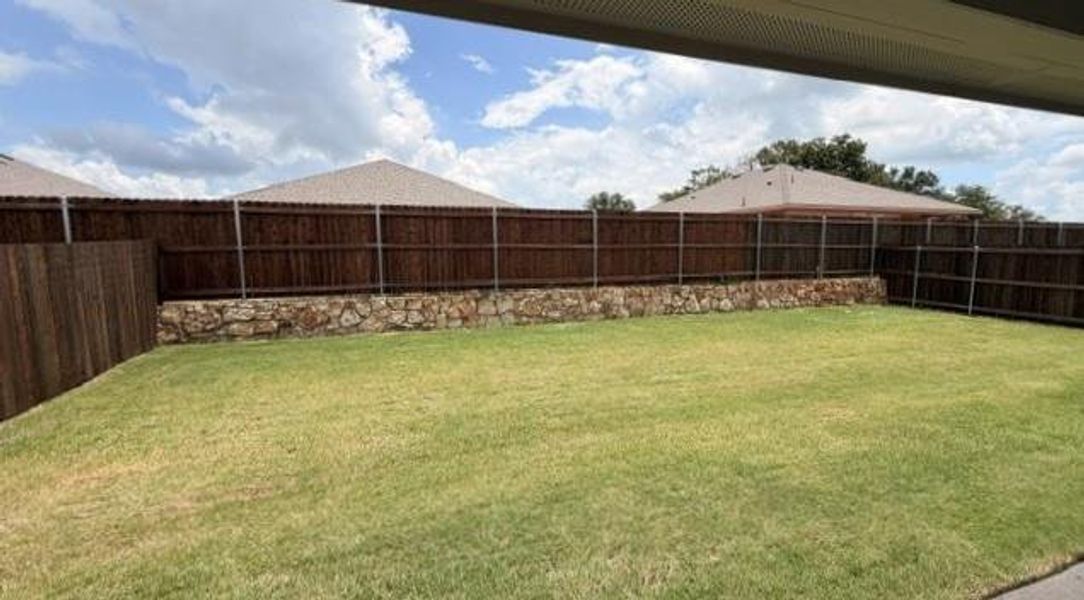 Exterior details and patio area of a home in Sandy Beach, Azle (Image 2).