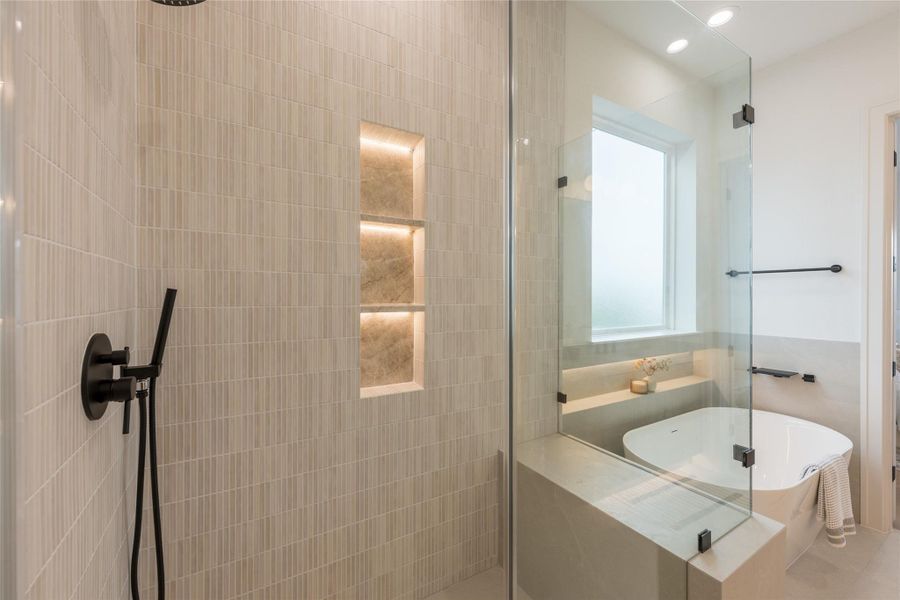 Designed so the small moments carry the space. The niche reads like a lantern built into the wall, the tile catches light without glare, and every piece of hardware was chosen in the same matte black so the eye never snags on a mismatched finish. A shower detailed at the level most homes reserve for the kitchen.