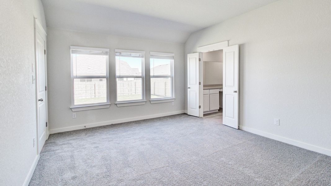 Representative furnished interior of a home built from the Paramount by Brightland Homes in Sunterra, Katy (Image 10).