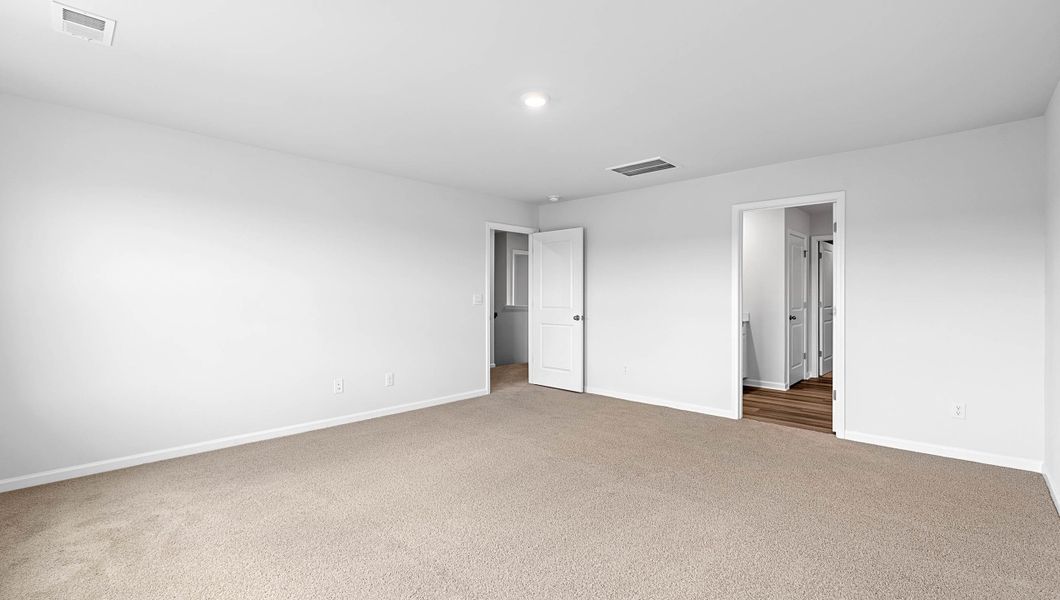 Spacious, unfurnished interior of a new home in Bentley Park, Greenwood (Image 29).