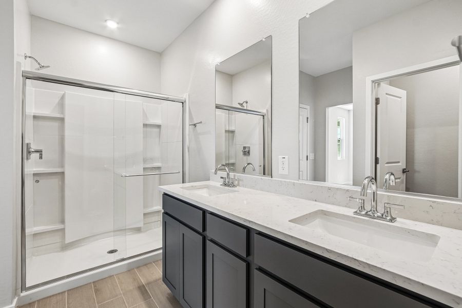 A bathroom with a glass shower.