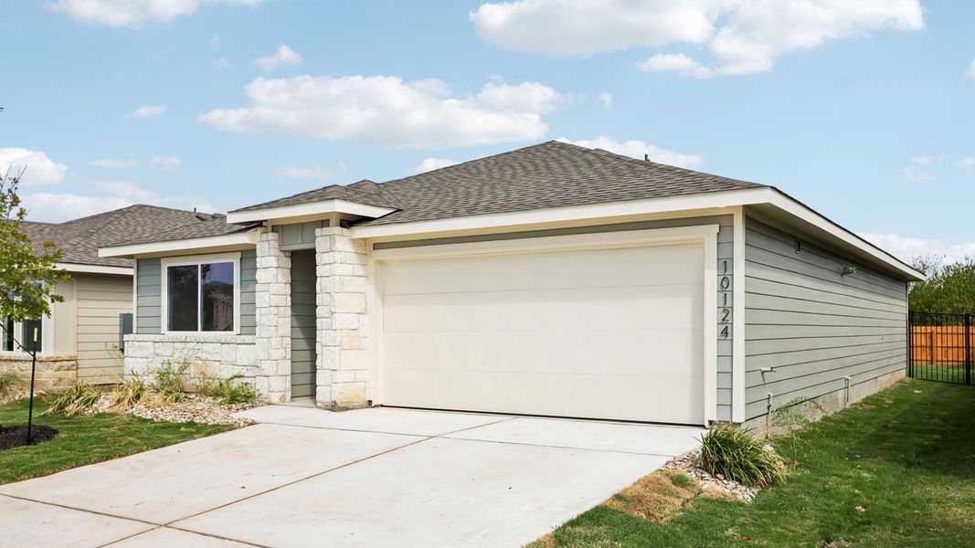 Front exterior of a new home in Trails at Wildhorse, Austin, TX, highlighting curb appeal (Image 2). Front exterior of a new home in Trails at Wildhorse, Austin, TX, highlighting curb appeal (Image 2).