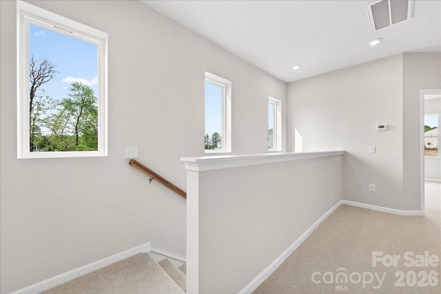 Second floor landing with end unit windows Second floor landing with end unit windows