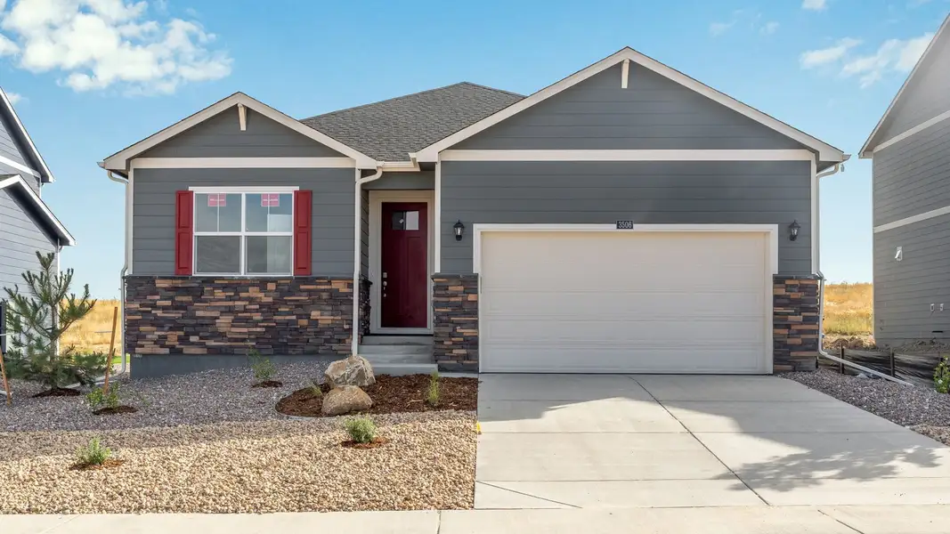 Front exterior of a new home in Vista Meadows, Fort Lupton, CO, highlighting curb appeal (Image 1). Front exterior of a new home in Vista Meadows, Fort Lupton, CO, highlighting curb appeal (Image 1).
