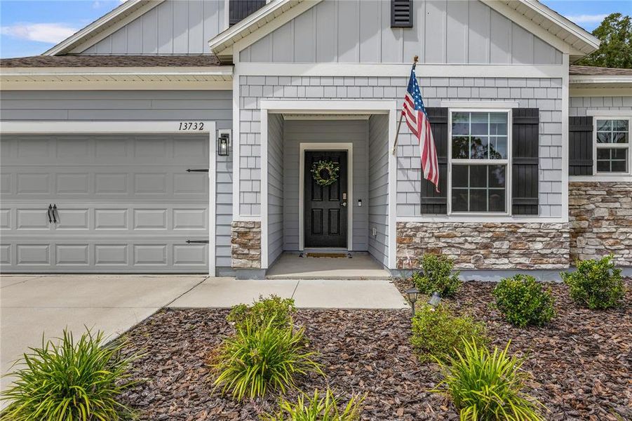 Front exterior of a new home in , Newberry, FL, highlighting curb appeal (Image 27).