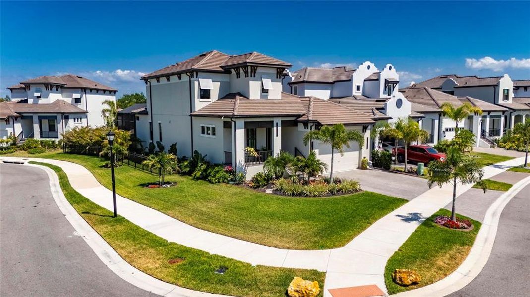 Front exterior of a new home in SouthShore Yacht Club, Ruskin, FL, highlighting curb appeal (Image 22).