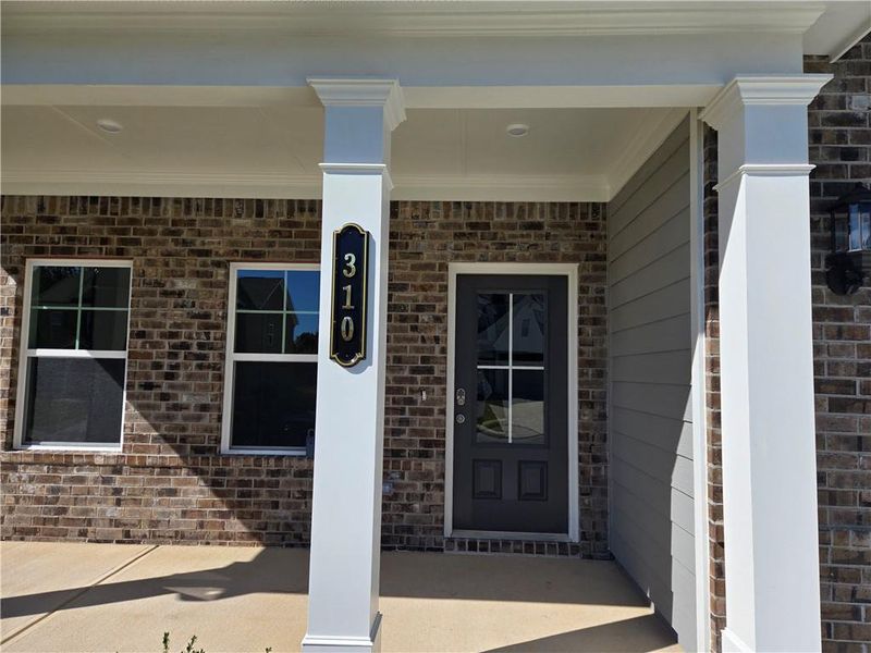 Exterior details and patio area of a home in Enclave at Logan Point, Loganville (Image 28).