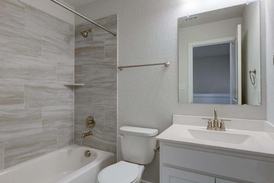 Representative furnished interior of a home built from the Guadalupe by Ashton Woods in The Heritage at Saddlebrook Ranch 70's, Schertz (Image 10).