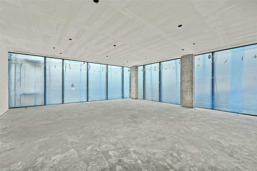 Spare room featuring concrete flooring