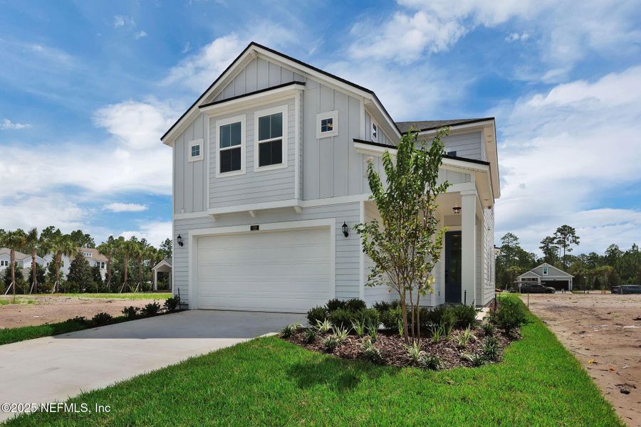 Front exterior of a new home in Crosswinds at Nocatee, Ponte Vedra, FL, highlighting curb appeal (Image 20).