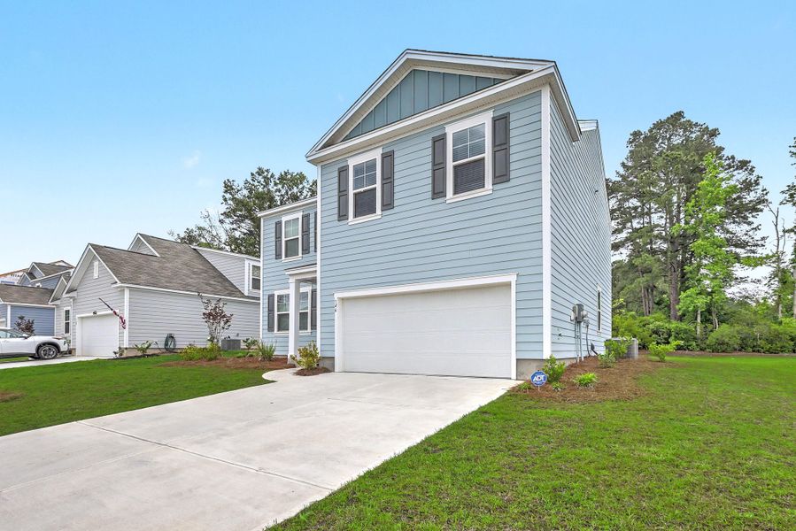 Front exterior of a new home in , Moncks Corner, SC, highlighting curb appeal (Image 19).