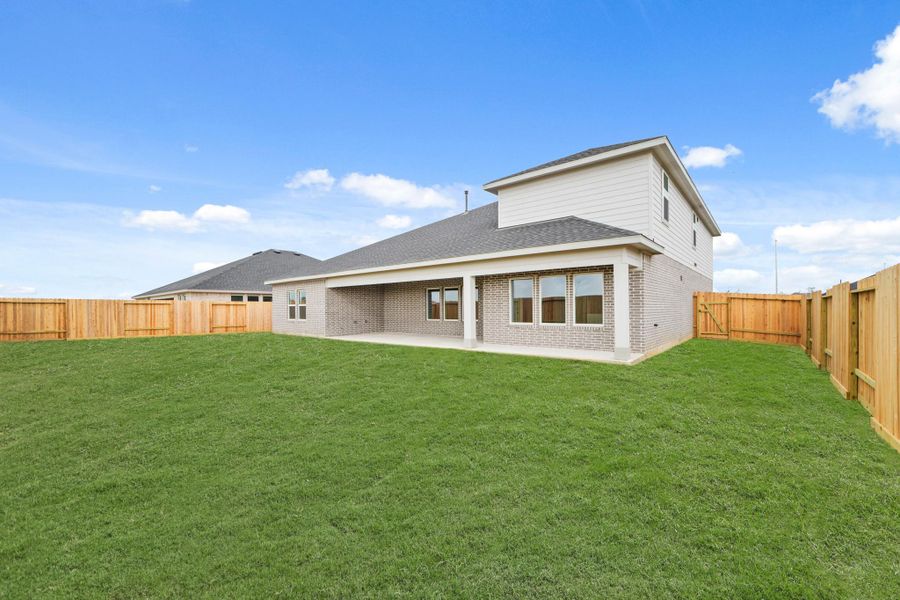 Exterior details and patio area of a home in Riverside Estates, Mont Belvieu (Image 3).