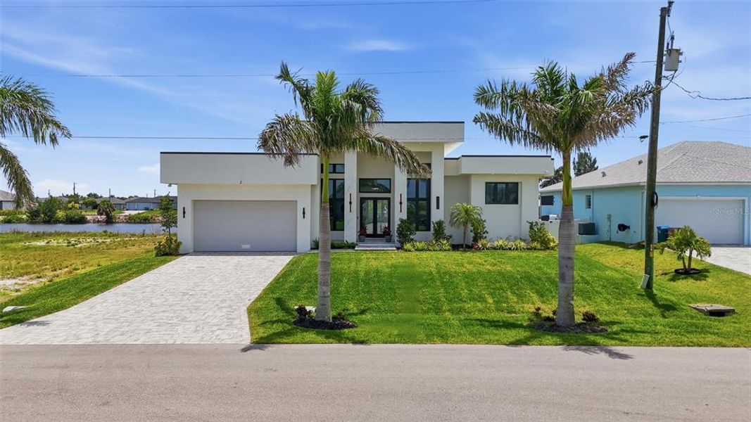 Front exterior of a new home in , Cape Coral, FL, highlighting curb appeal (Image 26).
