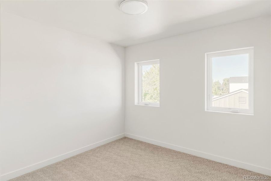 Bright secondary bedroom on 2nd level, three (of 4 bedrooms) on the same level Bright secondary bedroom on 2nd level, three (of 4 bedrooms) on the same level