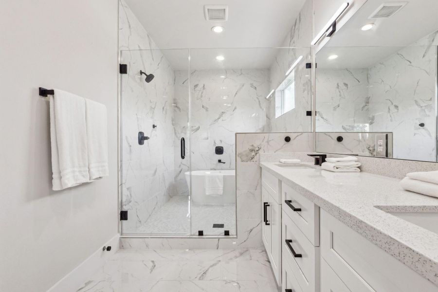 Master bathroom with double sinks and soaking tub