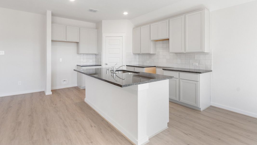 Representative furnished interior of a home built from the Blanton by Brightland Homes in Sunterra, Katy (Image 5).