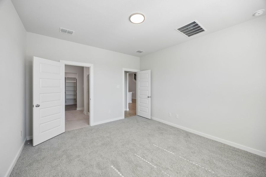 Primary Suite in the Mesquite home plan by Trophy Signature Homes – REPRESENTATIVE PHOTO