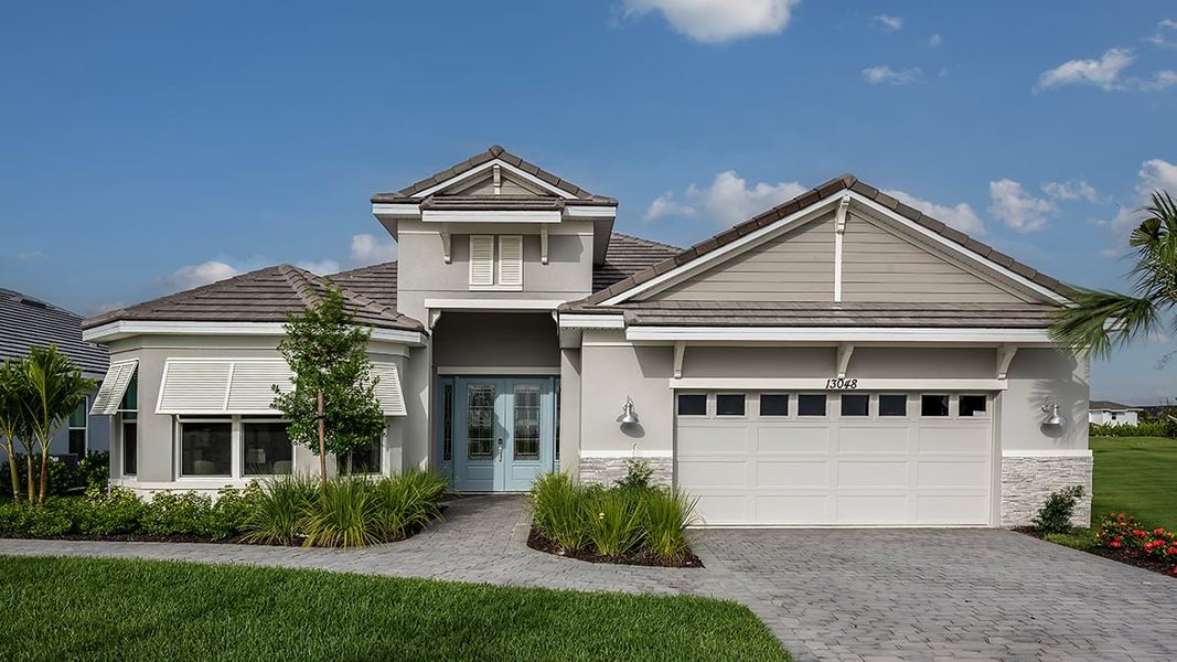 Representative exterior photo of a completed home built from the Pallazio by Taylor Morrison in Astor Creek Golf and Country Club, Port St. Lucie, FL (Image 23).