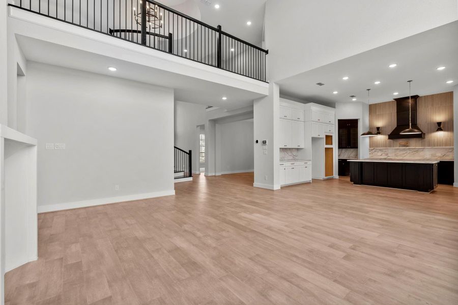 The open kitchen and living areas overlooked by the second floor.