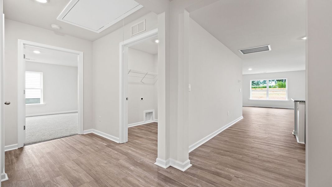 Spacious, unfurnished interior of a new home in Bentley Park, Greenwood (Image 16).