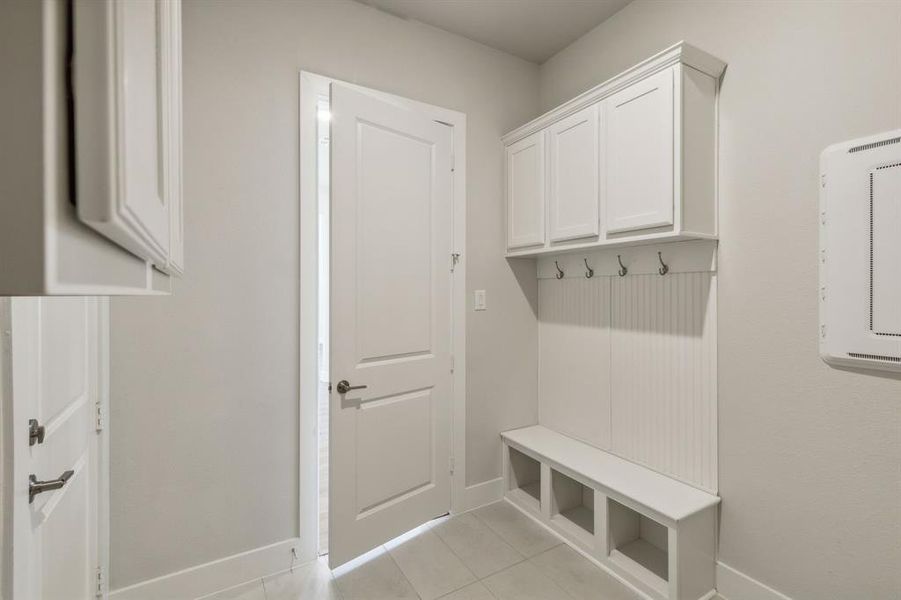 Mudroom featuring light tile patterned floors