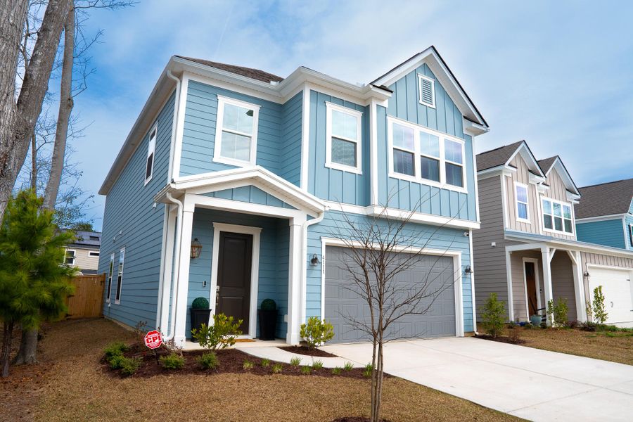Front exterior of a new home in Park's Edge at Carolina Bay, Charleston, SC, highlighting curb appeal (Image 1). Front exterior of a new home in Park's Edge at Carolina Bay, Charleston, SC, highlighting curb appeal (Image 1).