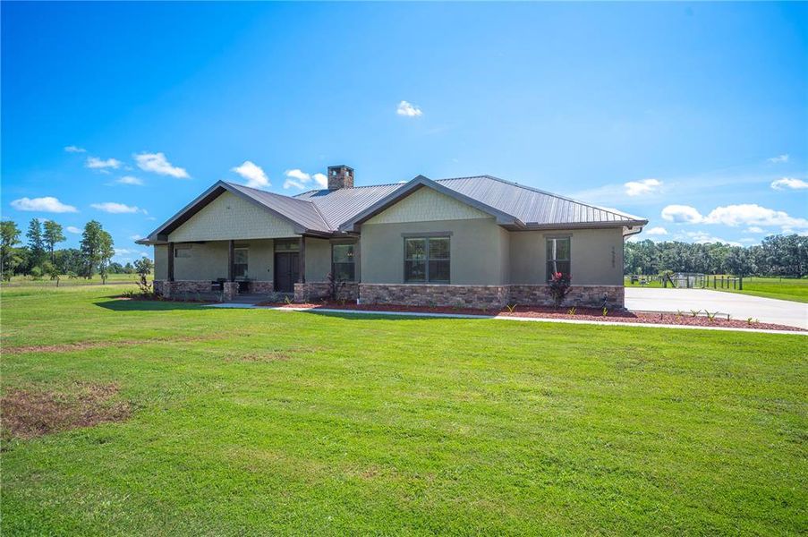 Front exterior of a new home in , Lakeland, FL, highlighting curb appeal (Image 1).