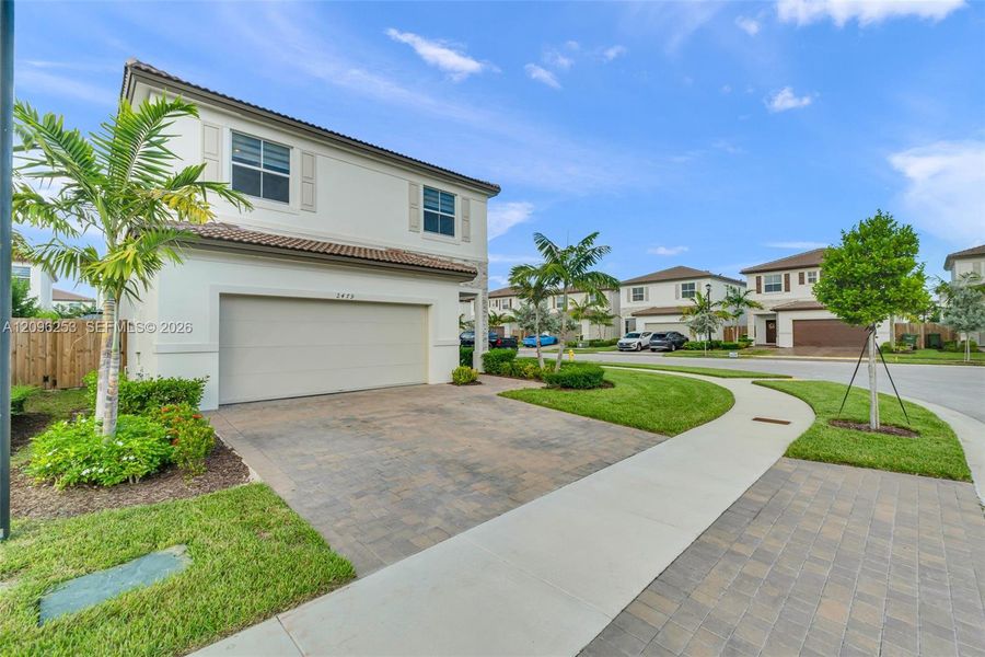 Front exterior of a new home in , Homestead, FL, highlighting curb appeal (Image 25). Front exterior of a new home in , Homestead, FL, highlighting curb appeal (Image 25).