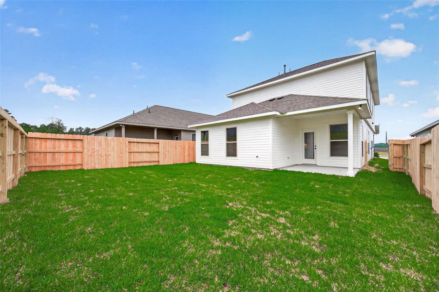 Exterior details and patio area of a home in Mostyn Springs, Magnolia (Image 22).