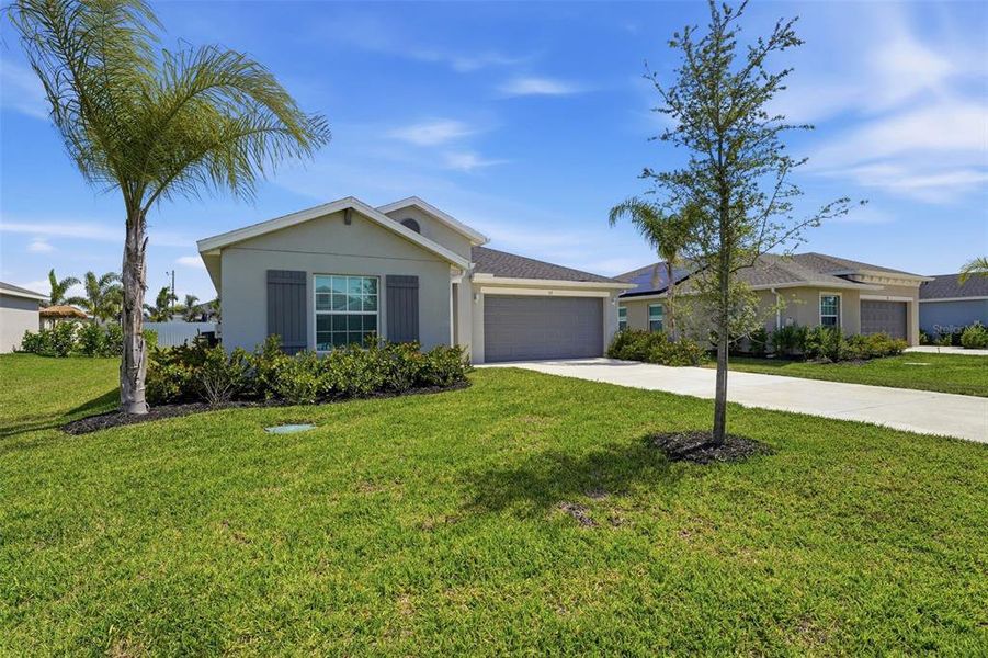 Front exterior of a new home in Rotonda Lakes, Rotonda West, FL, highlighting curb appeal (Image 26). Front exterior of a new home in Rotonda Lakes, Rotonda West, FL, highlighting curb appeal (Image 26).
