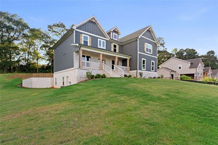 Exterior details and patio area of a home in Steeplechase, Hoschton (Image 23).