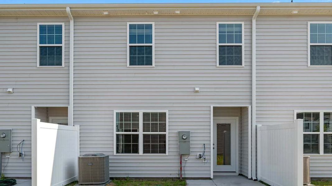 Exterior details and patio area of a home in The Townes at Ridgewood Farms, Winterville (Image 22).