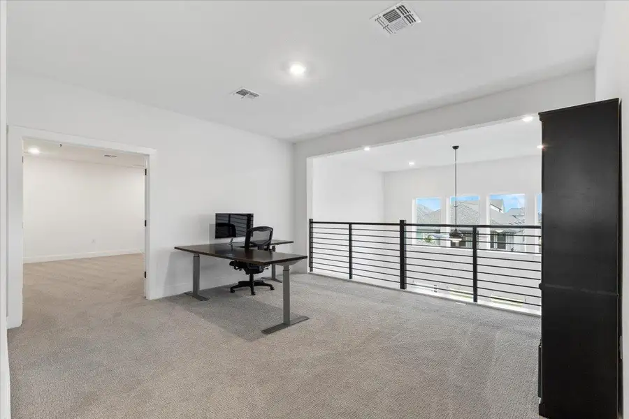 Office area featuring carpet flooring and recessed lighting