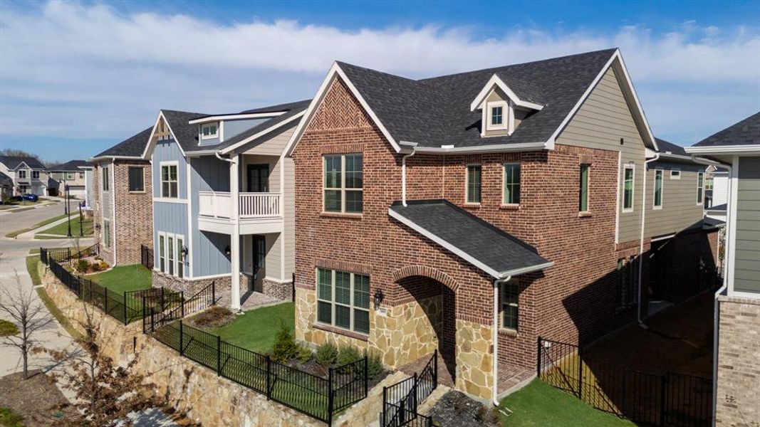 Front exterior of a new home in Bayside, Rowlett, TX, highlighting curb appeal (Image 2). Front exterior of a new home in Bayside, Rowlett, TX, highlighting curb appeal (Image 2).