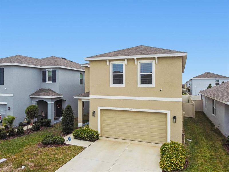 Front exterior of a new home in Westgate at Avalon Park, Wesley Chapel, FL, highlighting curb appeal (Image 30).